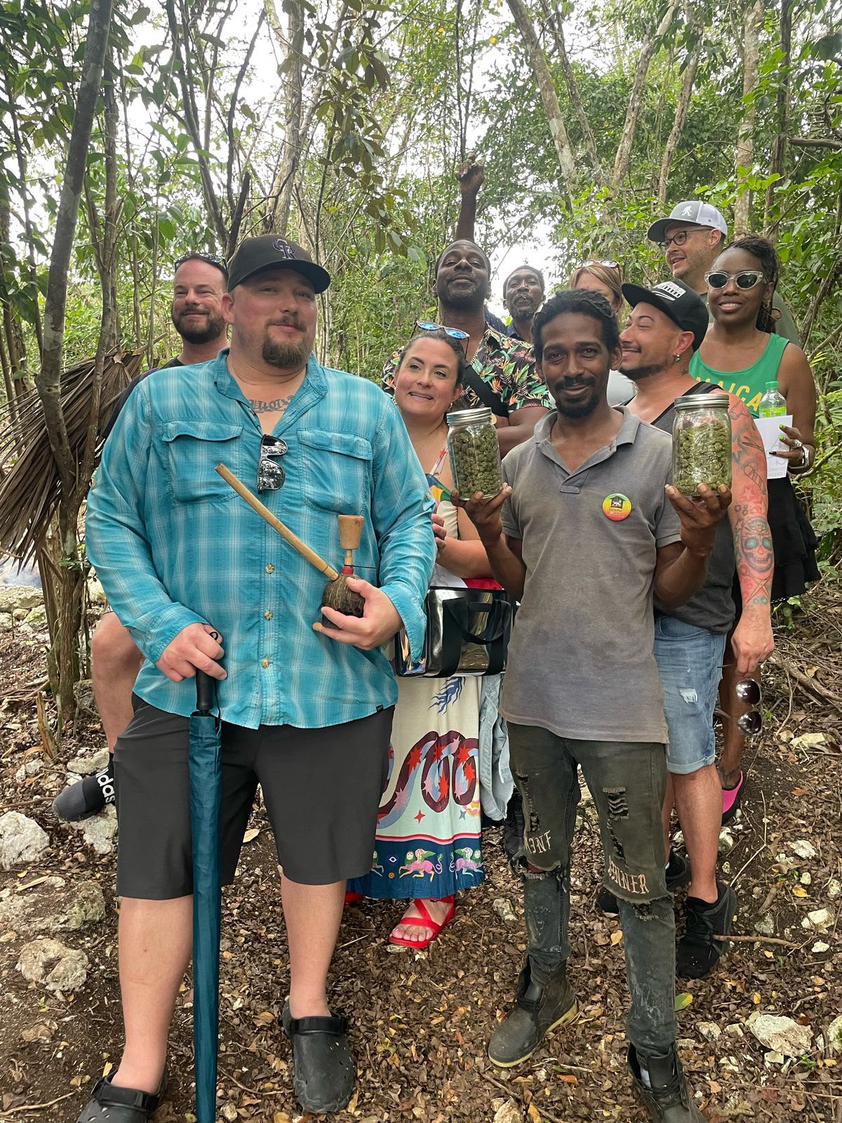 A group gathered beneath the trees at House of SEBA
